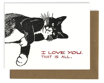 May include: A black and white cat with a white patch on its chest lies on its back with its paws in the air. The cat is looking up at the viewer. The text "I love you. That is all." is printed in red below the cat.