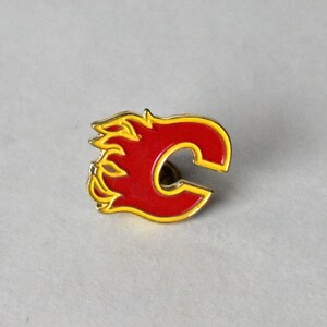 Calgary Flames, golden logo, NHL, red metal background, american