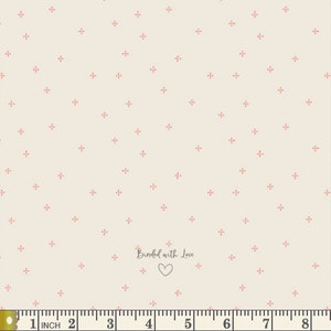 May include: Cream-colored fabric with a repeating pattern of small, red cross-like shapes. The fabric has a subtle texture and a ruler along the bottom edge, with measurements in inches. The text "Binded with Love" is also visible.