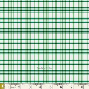 May include: A white and green plaid pattern fabric with vertical and horizontal lines. The fabric has a ruler along the bottom edge, with measurements in inches. The text "Binded with Love" is in the lower right corner.