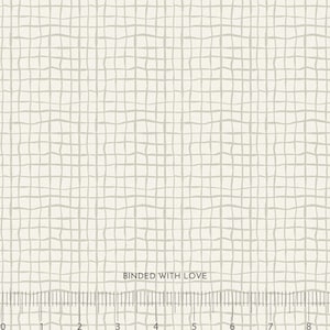 May include: Off-white fabric with a grid pattern in a light gray color. The text "BOUNDED WITH LOVE" is printed on the fabric. A ruler is at the bottom of the image, with measurements in inches.