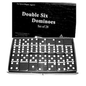 May include: A set of Double Six Jumbo Dominoes, featuring 28 black dominoes with white dots, displayed in a black box. The box has text that reads "Double Six Jumbo Dominoes Set of 28".