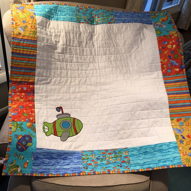 Baby Quilt with submarine appliqu\u00e9 and colorful under the sea creatures