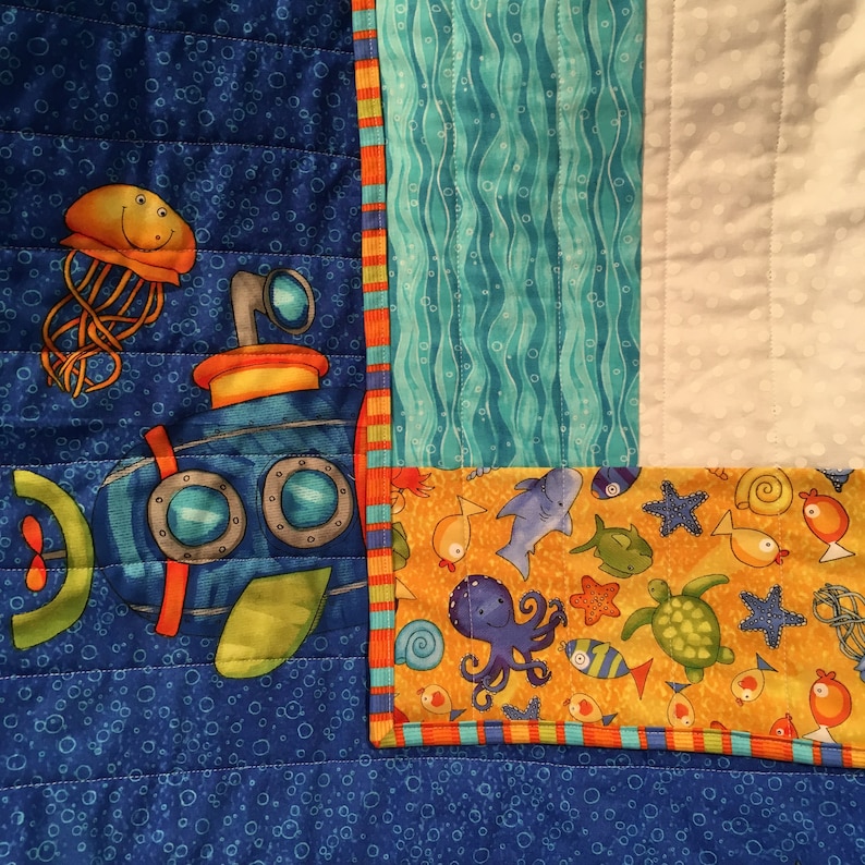 Baby Quilt with submarine appliqu\u00e9 and colorful under the sea creatures