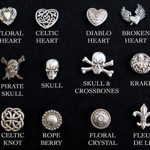 May include: A collection of 12 silver-toned metal buttons with various designs, including hearts, skulls, and knots. The buttons are arranged in four rows of three, with each button labeled with its name below it.