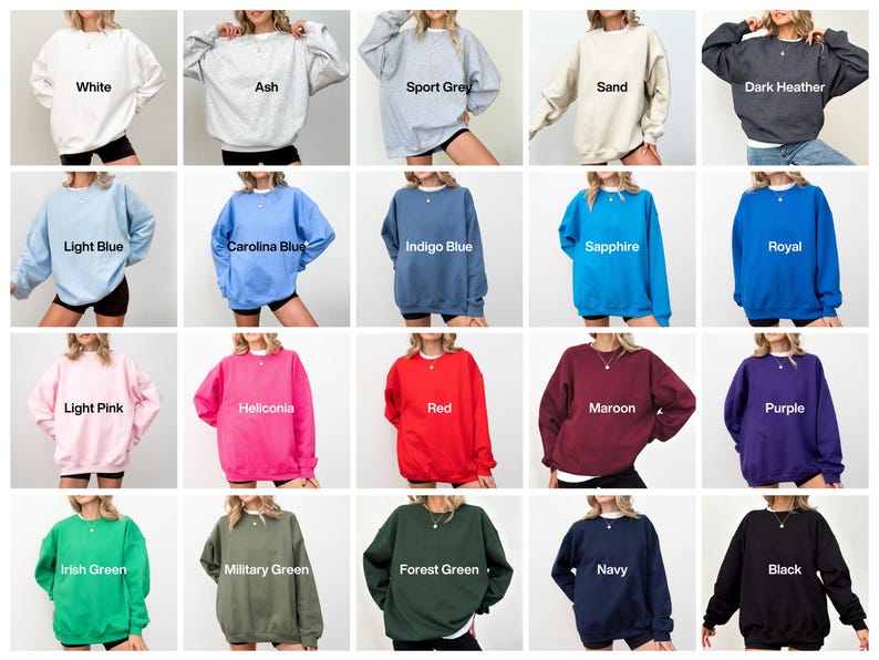 May include: A selection of crew neck sweatshirts in a range of colours. The colours include white, ash, sport grey, sand, dark heather, light blue, carolina blue, indigo blue, sapphire, royal, light pink, heliconia, red, maroon, purple, irish green, military green, forest green, navy, and black.