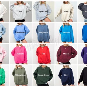 May include: A collection of crewneck sweatshirts in various colors, including white, ash, sport grey, sand, dark heather, light blue, carolina blue, indigo blue, sapphire, royal, light pink, heliconia, red, maroon, purple, irish green, military green, forest green, navy, and black.