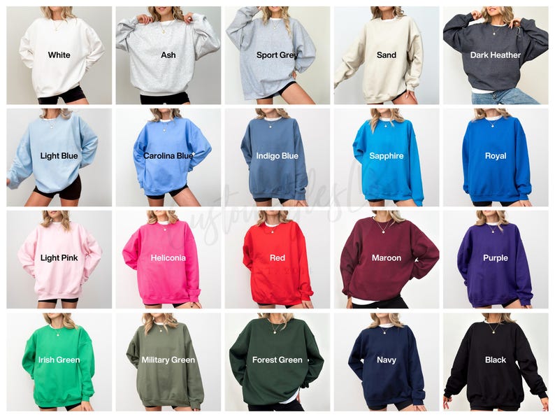 May include: A collection of crewneck sweatshirts in various colors, including white, ash, sport grey, sand, dark heather, light blue, carolina blue, indigo blue, sapphire, royal, light pink, heliconia, red, maroon, purple, irish green, military green, forest green, navy, and black.