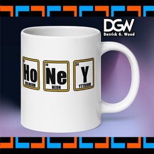 May include: White ceramic mug with the word "Honey" spelled out using periodic table elements: Holmium, Neon, and Yttrium. The mug has a white handle and the text "DGW Derrick G. Wood" is printed on the side.
