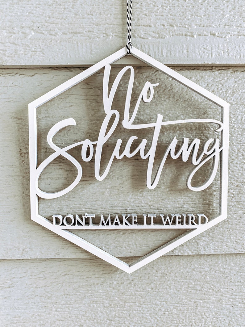 May include: White hexagonal sign with the text "No Soliciting" and the phrase "Don't Make It Weird" in a smaller font.