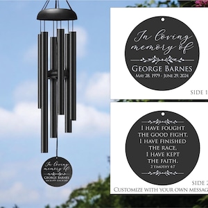 May include: Black memorial wind chimes with a round pendant that reads "In loving memory of George Barnes" and dates. The second side reads "I have fought the good fight..." and "Customize with your own message."