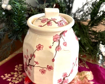Cherry Blossom covered jar. Hand made on the potters wheel and hand painted.