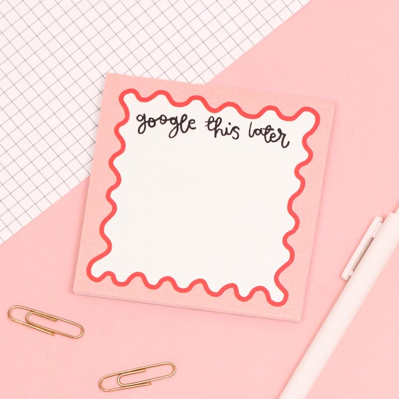 May include: Pink sticky note with a red scalloped border and the text "google this later" written in black.