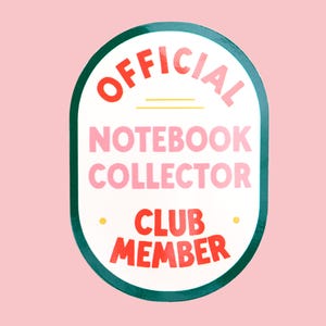 May include: A sticker with a white oval centre and a green border. The text "OFFICIAL NOTEBOOK COLLECTOR CLUB MEMBER" is in red and pink, with a yellow line and dots. The background is light pink.