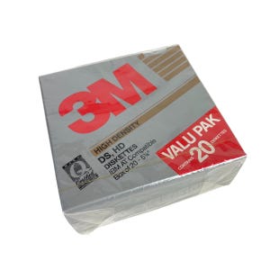 May include: A box of 3M high density 5.25 inch floppy disks. The box is gray with red and gold accents. The text on the box reads "3M", "High Density", "DS, HD Diskettes", "IBM AT Compatible", "Box of 20 - 5 1/4"
