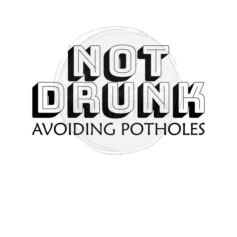 May include: Black and white graphic design with the words "NOT DRUNK" in bold, 3D lettering above "AVOIDING POTHOLES" in a smaller font. The text is centered on a white background.