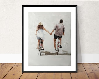 May include: Framed art print of a couple holding hands while riding bicycles. The painting depicts a man and a woman on bikes, viewed from behind, with a neutral color palette. The artwork is framed in a black frame.
