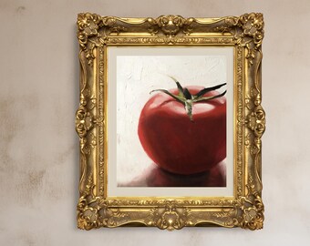 May include: A framed painting of a ripe red tomato with green stem and leaves. The artwork is displayed in an ornate gold frame, set against a neutral background. The painting captures the tomato's texture and color.