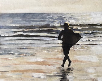 May include: An oil painting depicts a silhouetted figure running on a beach toward the ocean. The artwork uses a palette of muted blues, tans, and whites to portray the sea, sand, and sky. The figure's dark form contrasts with the lighter background.