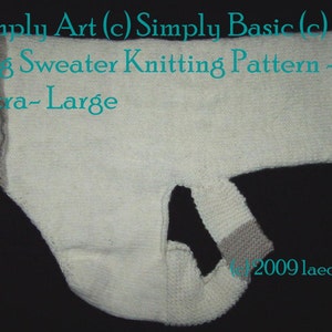 May include: White knitted dog sweater pattern for extra-large dogs. The sweater is laid flat on a black surface. The sweater has a hole for the dog's head and two holes for the dog's legs.