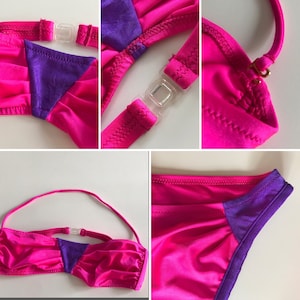 May include: A pink and purple bikini top with adjustable straps and a clasp fastening. The top has a bandeau style with a gathered detail at the front.
