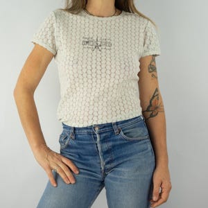 Gaultier Jeans | Vintage Jean Paul Gaultier Women&#39;s T-Shirt | Stretch Lace Mesh | Semi-Sheer | Printed Chest Logo | Size L
