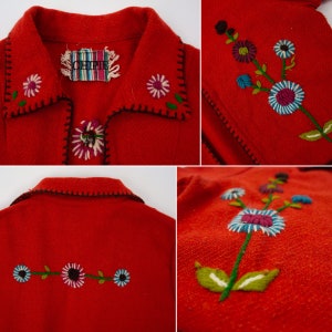 May include: Red wool jacket with embroidered flowers in shades of blue, green, pink, and white. The jacket has a black trim and a label that reads "OHIR".