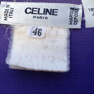 May include: A white tag with black text that reads "CELINE PARIS" and "MADE IN ITALY". A smaller white tag with black text reads "MARQUE DEPOSEE". A white tag with black text reads "46". A white tag with black text reads "19225009 JANSSEN".