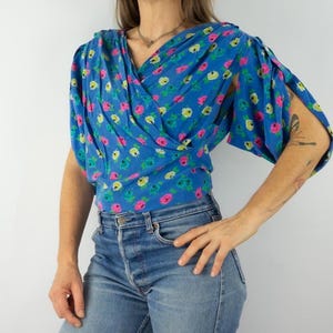Krizia Vintage Women’s Blouse 1990s | Colorful Floral Print | Wrap-Style Collar | Puff Sleeves | 100% Silk | Made in Italy | Size L