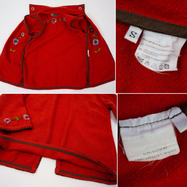 May include: Red fleece jacket with embroidered flowers and a brown zipper. The jacket has a size tag that says "S".