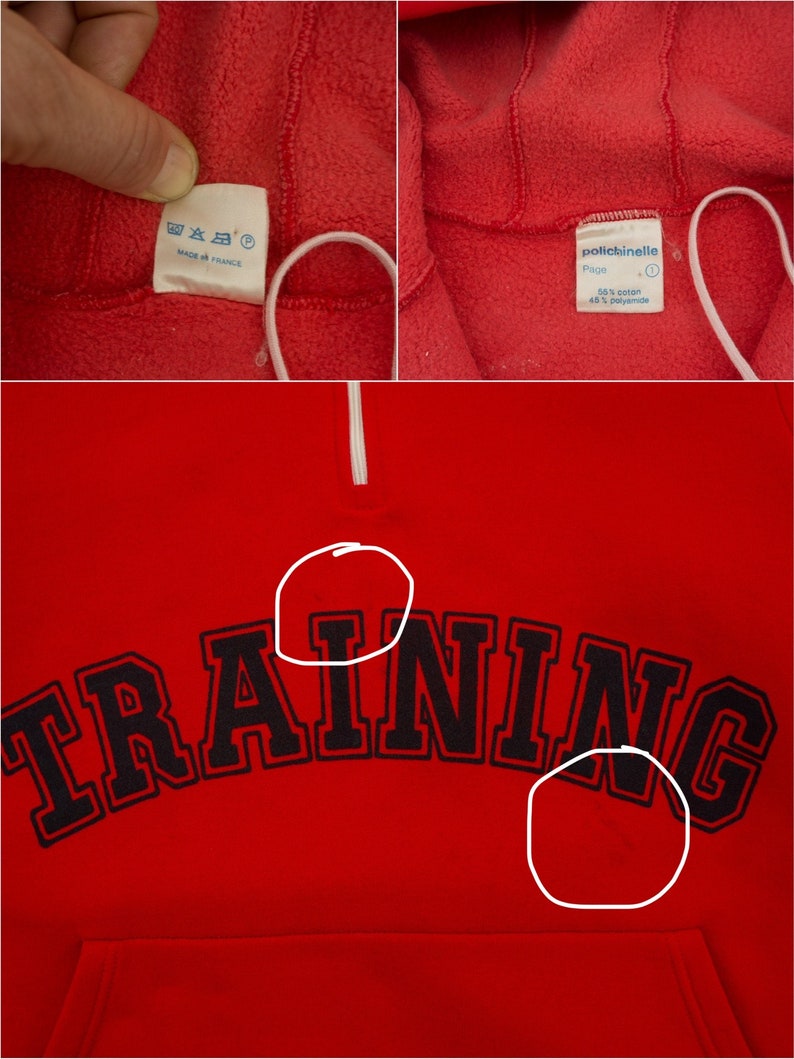K&ouml;nnte beinhalten: Roter Fleece-Pullover mit einem schwarzen "TRAINING"-Aufdruck auf der Vorderseite. Der Pullover hat einen wei&szlig;en Rei&szlig;verschluss und ein Etikett mit der Aufschrift "polticinelle" mit dem Text "68% Baumwolle 32% Polyamid".