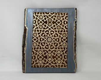 May include: A wooden wall art piece with a geometric design in gold and brown. The design is framed in a blue painted wood frame.