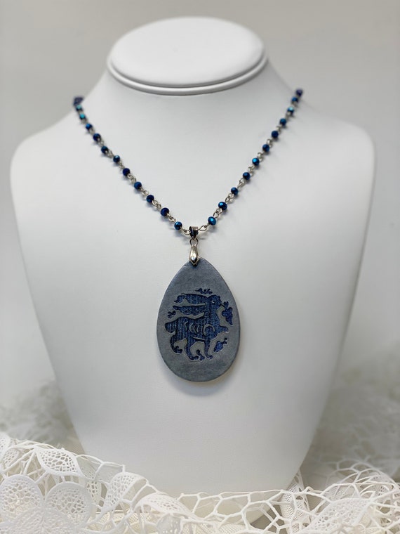 The Arabesque® Wooden Engraved Medieval Bunny Teardrop Pendant with Cobalt Blue Glass Bead and Rhodium Plated Rosary Necklace