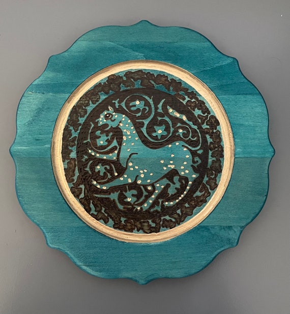 The Arabesque Medieval islamic lioness  wood burned on plate, decorative plate.