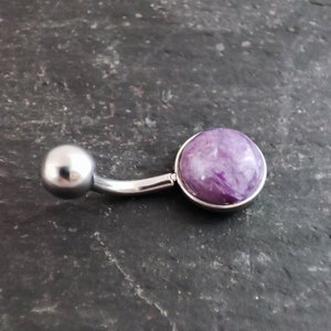 8mm purple charoite cabochon set in a polished 316l steel belly bar on a slate background