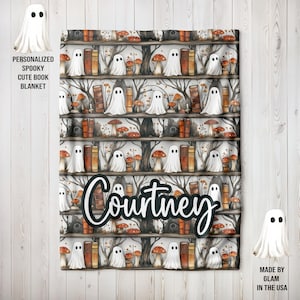 May include: A personalised spooky blanket with a bookshelf design, featuring ghosts, mushrooms, and books. The name "Courtney" is displayed in a cursive font. The blanket is white, brown, and orange.