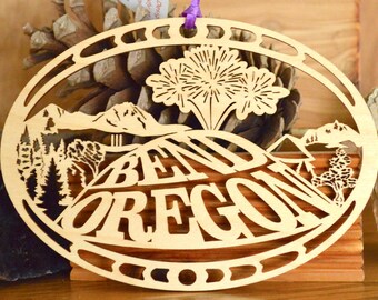 Wood Bend Oregon ornament woodcut ornament of Bend Oregon with Pilot Butte Cascade Mountains fireworks