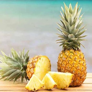 May include: Two whole pineapples and three pineapple slices on a wooden surface. One pineapple is cut in half and the other is whole. The pineapple slices are arranged in a semi-circle.