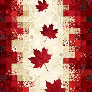May include: A fabric panel with a patchwork design in red and cream, featuring large red maple leaves. The panel size is 61cm x 109cm. The design includes squares and rectangles with leaf patterns.