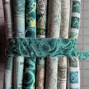 May include: A set of three ceramic mugs with a speckled, matte finish in cream, light grey, and dark grey. Each mug has a simple, minimalist design, ideal for tea or coffee.