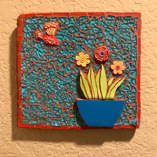 Mosaic garden wall decor with hummingbird