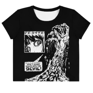 May include: Black and white graphic t-shirt with a manga-style illustration of a hand reaching out from a dark background. The text "デス・ライブス!" and "IF YOU VALUE YOUR SOUL- DON'T SHAKE HANDS WITH THE DEVIL!" is printed on the shirt.
