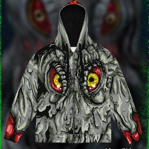 May include: A gray zip-up hoodie featuring a monster face graphic with large red eyes and yellow irises. The design includes a black hood lining and red accents on the sleeves. The text "MIDNIGHT MONSTER" is printed at the bottom.