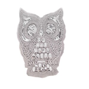May include: A silver sequined owl applique with a detailed design. The owl is outlined in white and has a gray background.