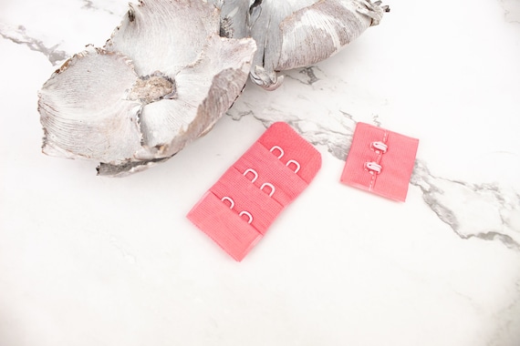 Cierre de sujetador con gancho y ojal rosa x para pares NTN00062