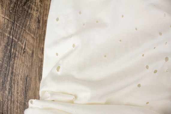 Off White Laser Cut Hole Knit Jersey Fabric - Rayon Spandex Blend