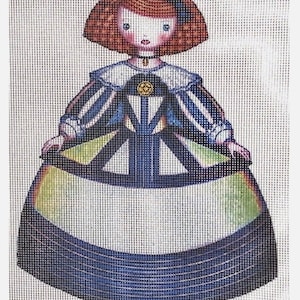 May include: A needlepoint canvas featuring a whimsical doll with red hair, blue eyes, and a blue and green dress. The doll is wearing a white collar and a gold pendant.