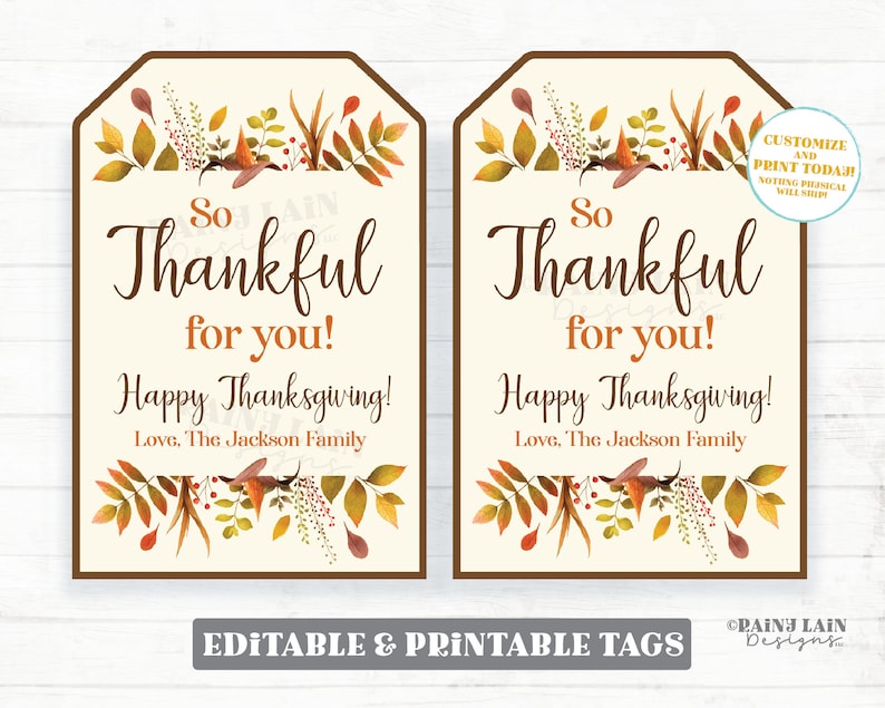 May include: Two printable Thanksgiving gift tags with a fall foliage design. The tags are beige with brown borders and feature the text "So Thankful for you! Happy Thanksgiving! Love, The Jackson Family".