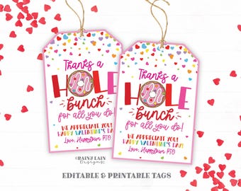 May include: Two pink printable Valentine's Day gift tags with a donut design. The text on the tags reads "Thanks a Hole Bunch for all you do! We appreciate you! Happy Valentine's Day! Love, Happytown PTO".