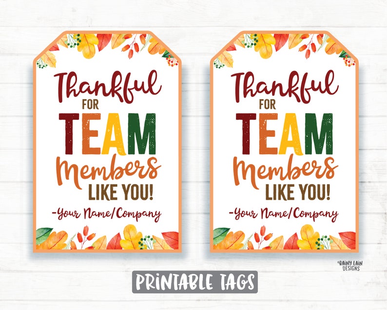 May include: Two printable gift tags with a fall theme. The tags are decorated with orange, yellow, and red leaves. The text on the tags reads "Thankful for Team Members Like You! -Your Name/Company".